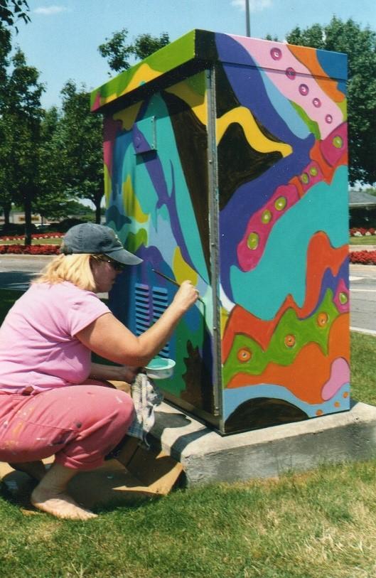 Zanne Brunner – Irondequoit Plaza (Wegmans entrance). Part of the Silver Box Project in Irondequoit, NY which transforms traffic signal control boxes into works of art.